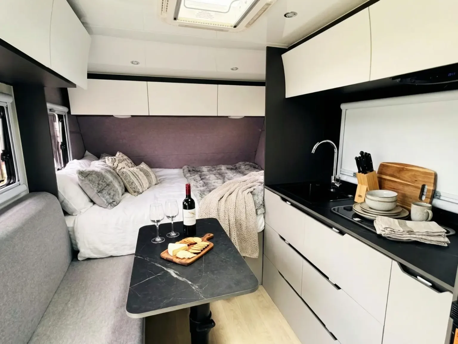 Venus 14 interior with queen bed, dinette and kitchen